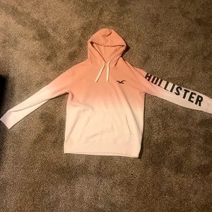 pink and white Hollister hoodie